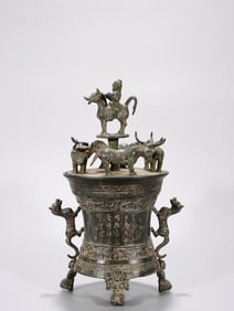 A Bronze Storage Vessel with Four Knight Handles and Inscription