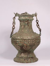 A Bronze Teapot with Silver Inlay and Chain
