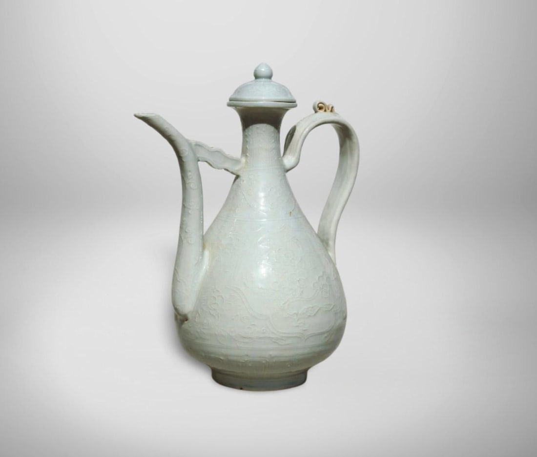 A Blue and White Wine Pot: A Blue and White Wine Pot. Dimension: 13.5" x 10.5".