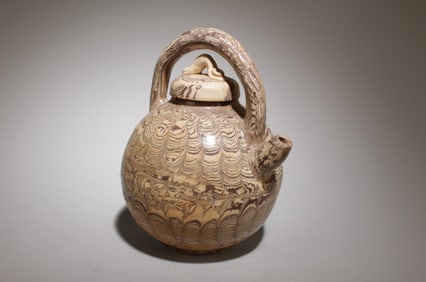 A Hanging Rubber Tire Glaze Wine Pot