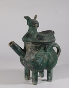A Bronze He with Bird Motif