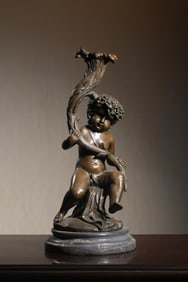 A Bronze Western Child Candlestick