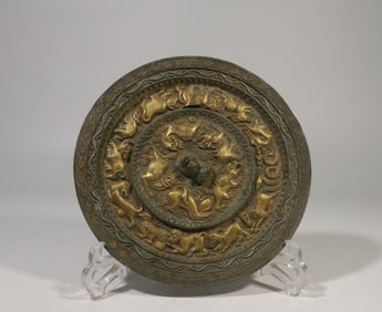A Gilt Bronze Mirror with Zodiac Motif