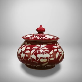 A Red and White Container with Lid