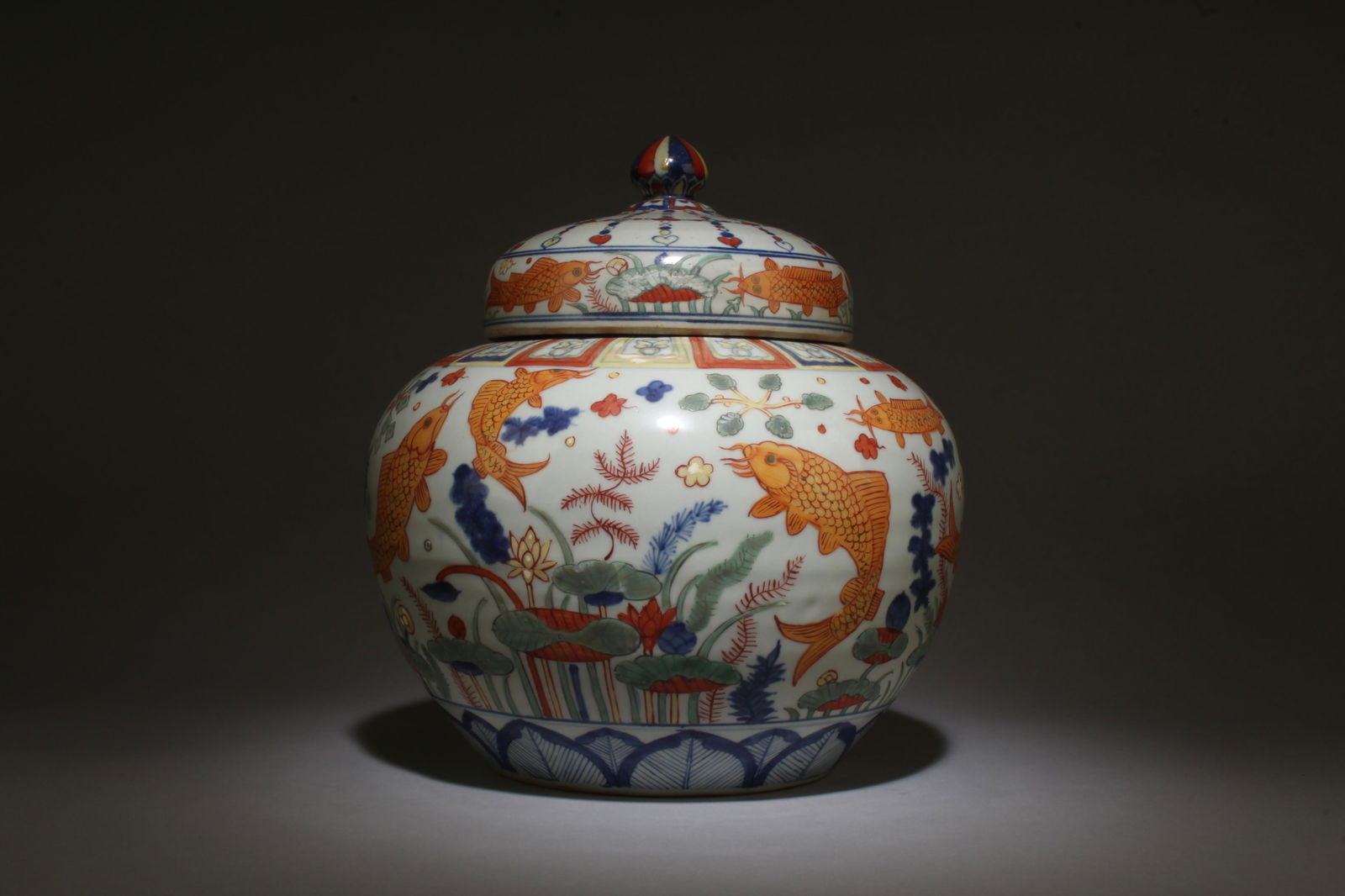 A Wucai Jar with Lid: A Wucai Jar with Lid. Dimensions: 9.5" x 10.5".