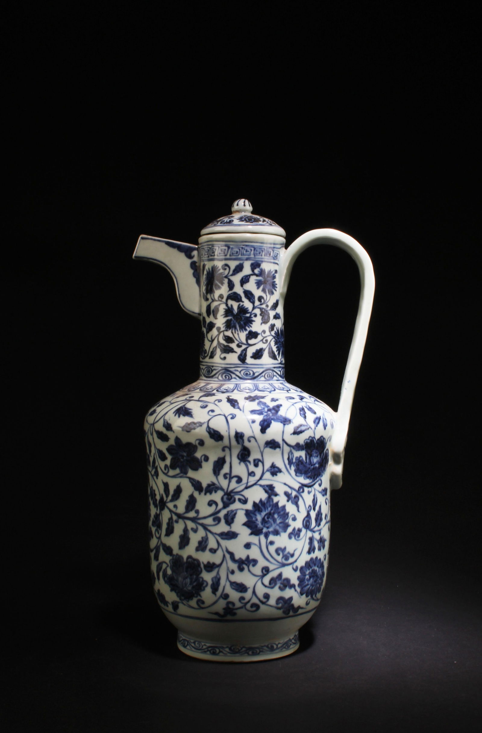 A Blue & White Porcelain WinePot: A Blue & White Porcelain WinePot. 'xuanDe' mark. Height: 15" Length: 8.25"