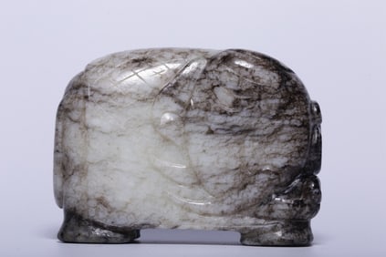 A Hetian Jade Elephant Ornament With Green Inclusions