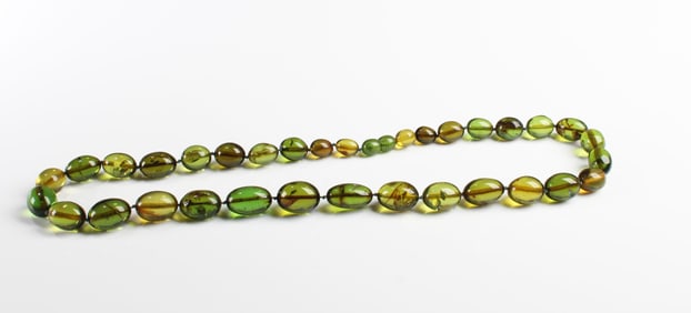 An Antique Chinese Amber Beaded Necklace