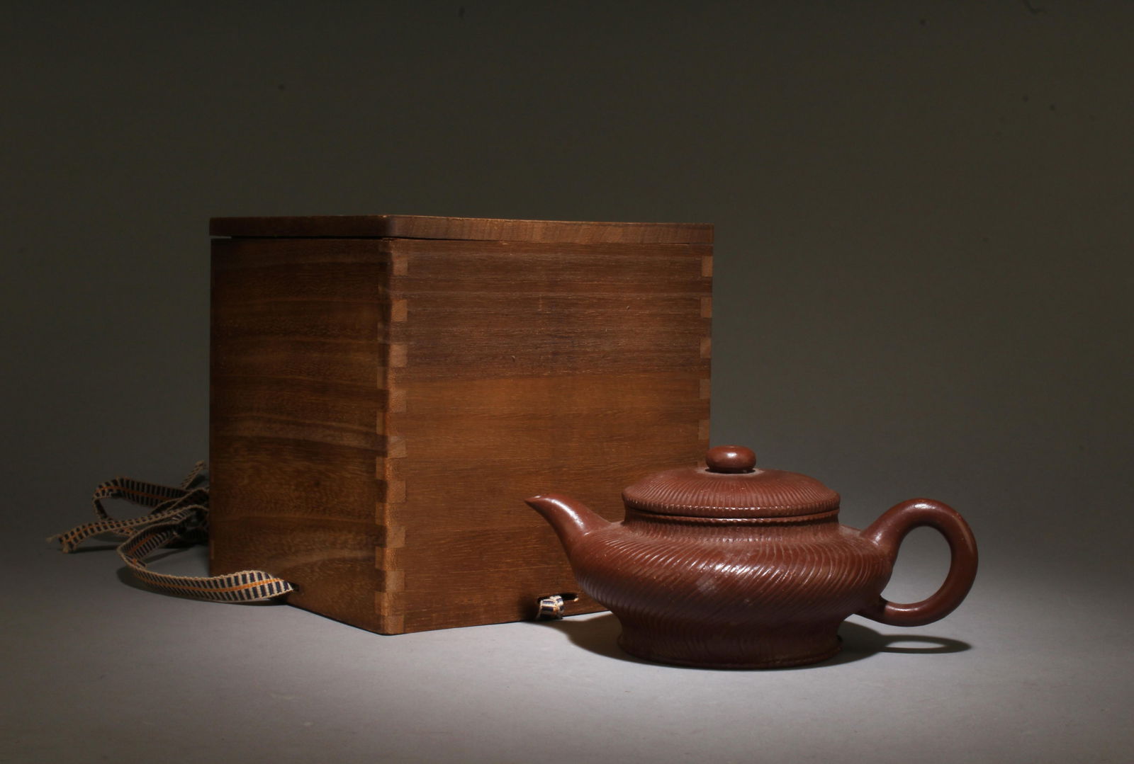 A Zisha Teapot: A Zisha Teapot. Comes with box. Height: 3in Diameter: 6.3in.