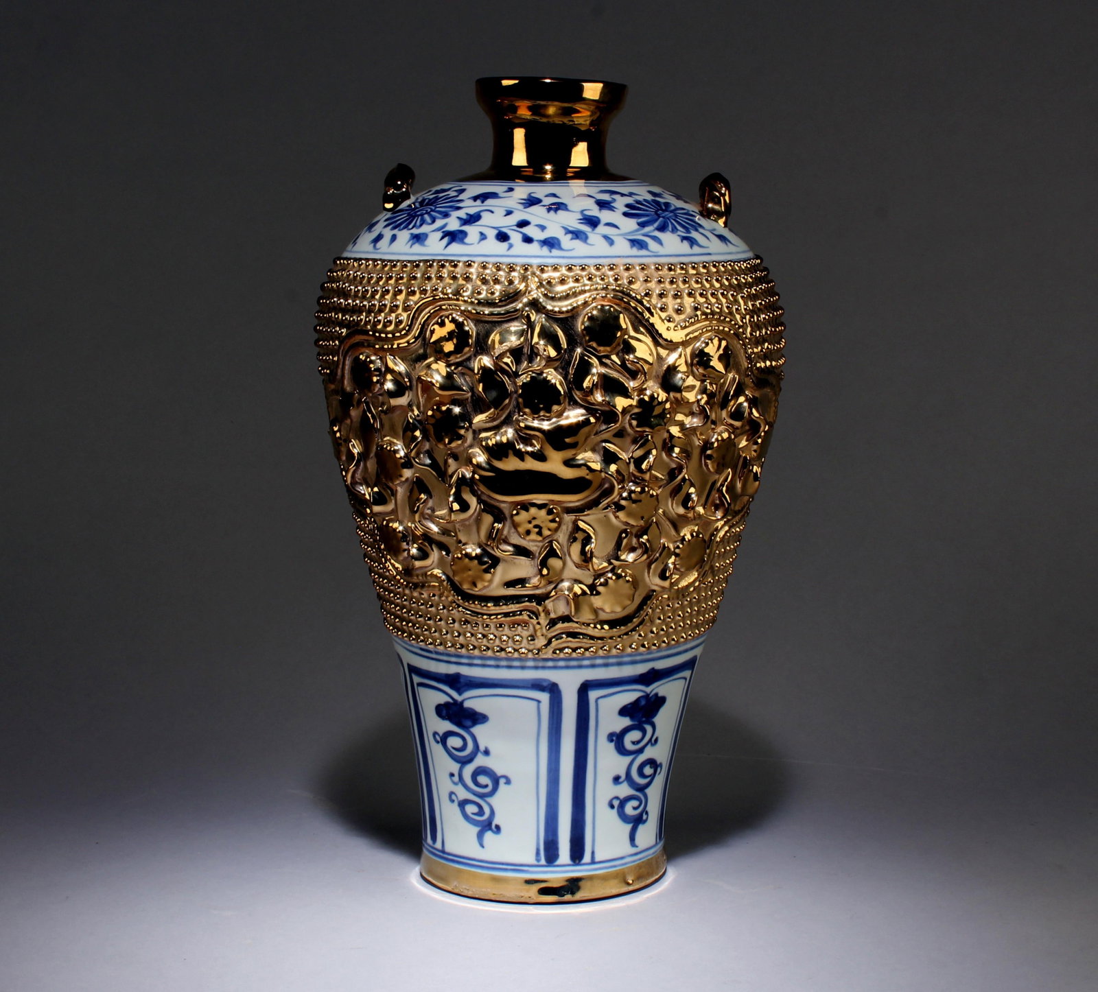 A Blue and White Vase with Gold Accents: A Blue and White Vase with Gold Accents. Dimensions: 13" x 7.5".