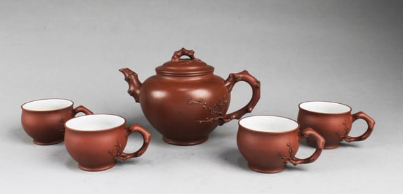 A Yixing Zisha Teapot with Four Cup Set