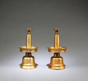 A Pair of Gilt Bronze Candle Holdlers