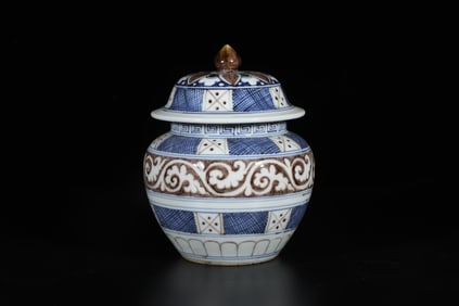 A Blue, White, and Red Jar with Lid