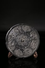 A Bronze Mirror With Floral Medallion Design