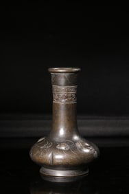 A Bronze Long-Neck Vase With Floral Design