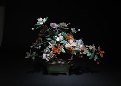 A Jade Flower Pot With Flowers