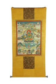 A TIBETAN THANGKA ON SILK FRAME