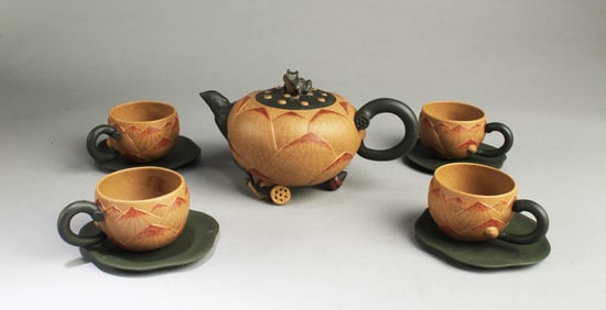 Early 20th C, A Nine-Piece YixingTeapot Set