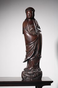 A Longyan Wood Guanyin Statue