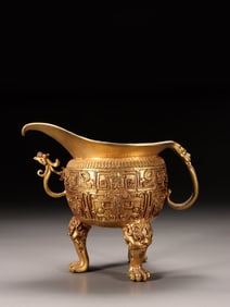 A Gilt Bronze Tripod Jue Cup