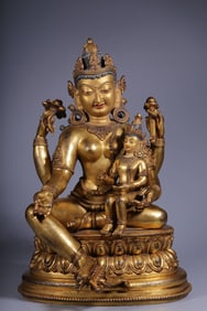 A Gilt Bronze Four-Armed Guanyin Statue