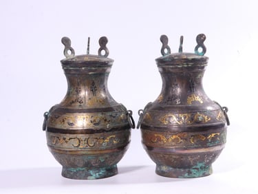 A Pair of Bronze Inlaid Covered Bottles