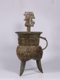 A Bronze Jue with Bird and Beast Motif