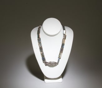 A Necklace Featuring a Handmade Silver Fish