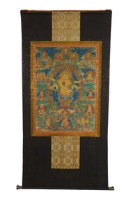A TIBETAN THANGKA ON SILK FRAME