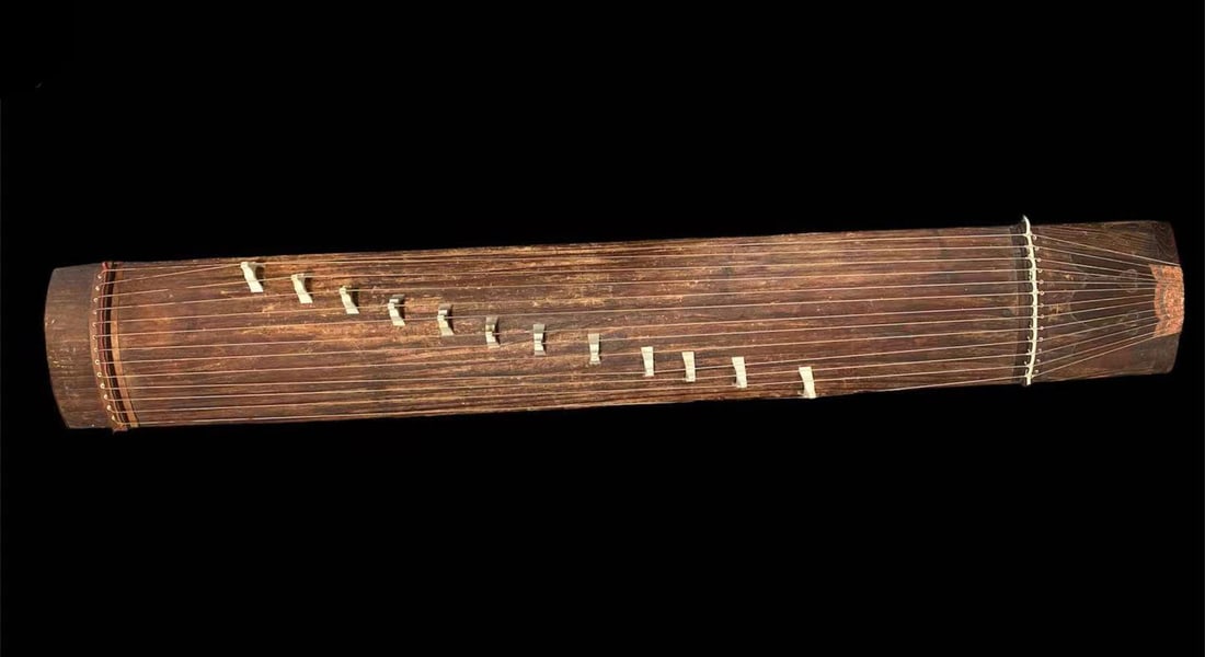 An old Chinese GuZheng: An old Chinese GuZheng. Length: 63.75" Width: 13.25"