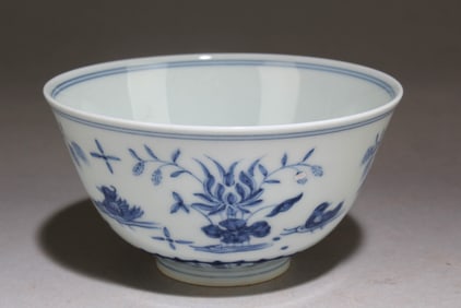 A Blue and White Chinese Cup with a Floral Pattern