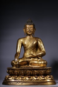 A Gilt Bronze Acala Buddha Statue