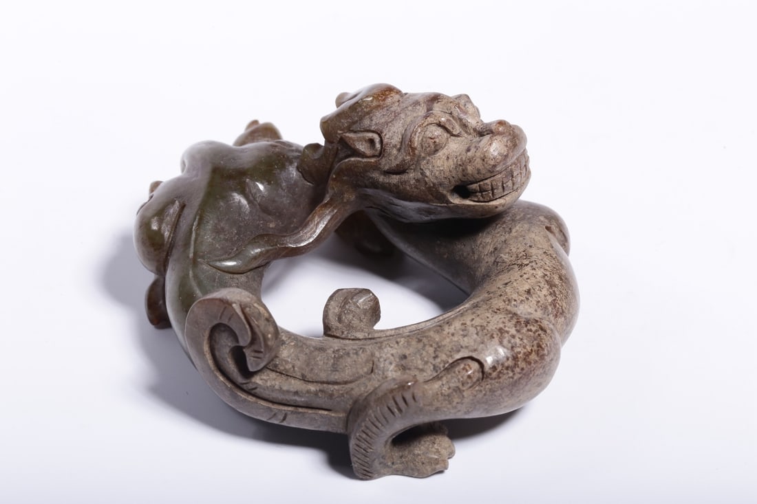 An Archaic Jade Dragon Paperweight: An Archaic Jade Dragon Paperweight. Dimensions: 1.38in x 2.56in x 2.17in; Weight: 0.20lbs.