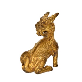 Qing Dynasty, A Gilt Bronze Qilin Paper Weight