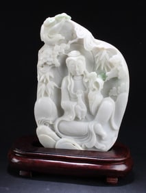 A Carved Jade Guanyin Statue With Stand