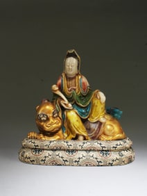 A Carved Polychrome Soapstone Guanyin Statue