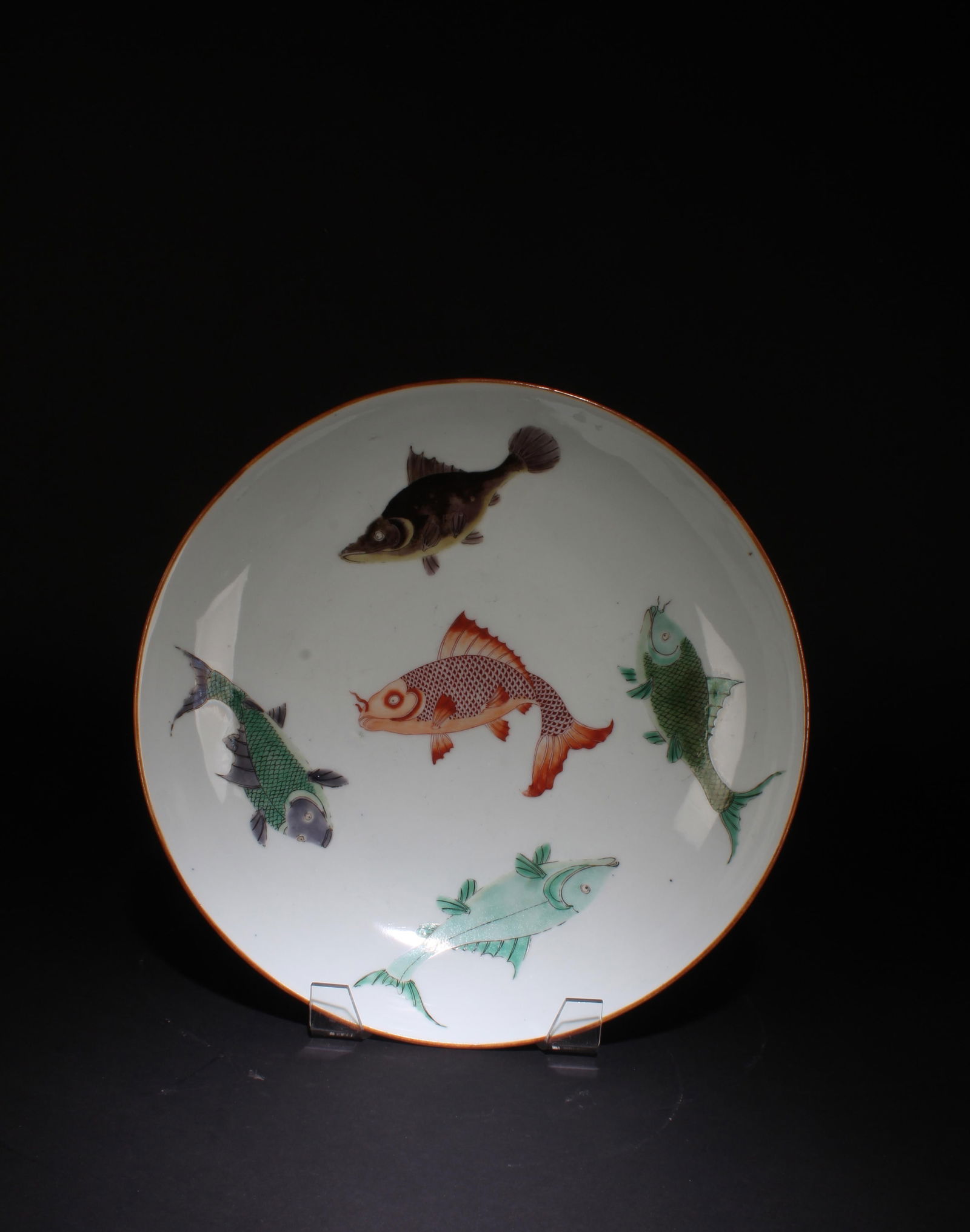A Porcelain Plate: A Porcelain Plate, the interior featuring five fishes. Diameter: 13.5"