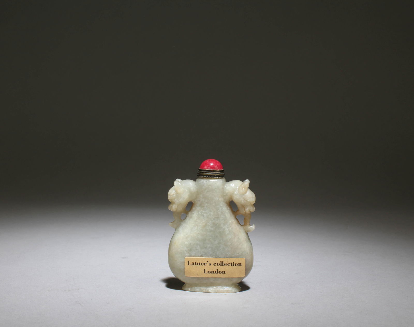 A Jade Snuff Bottle: A Jade Snuff Bottle. Dimensions: 2.6" x 1.75".