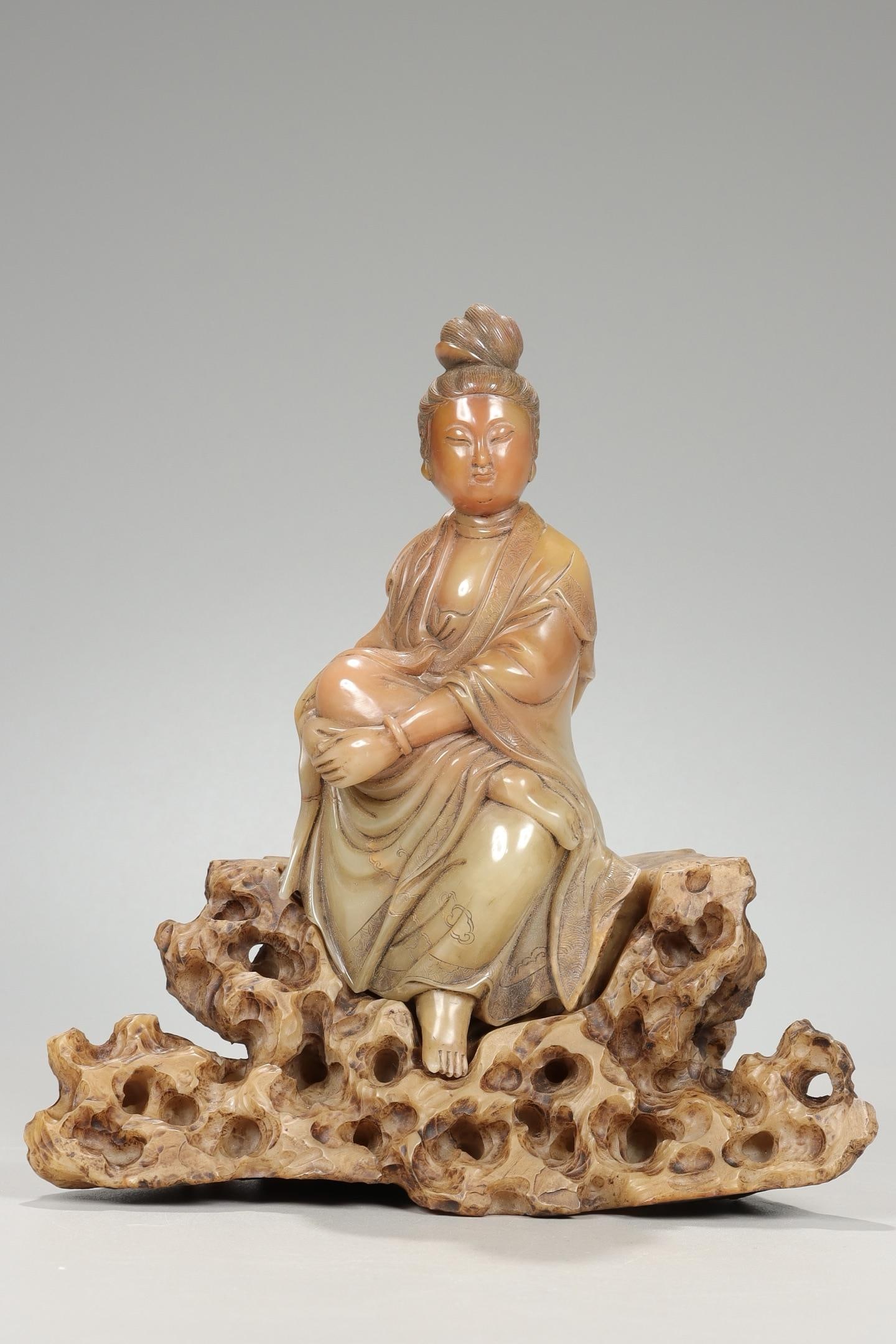 A Shoushan Stone Seated Guanyin Ornament: A Shoushan Stone Seated Guanyin Ornament. Dimensions: 8.07in x 7.28in.