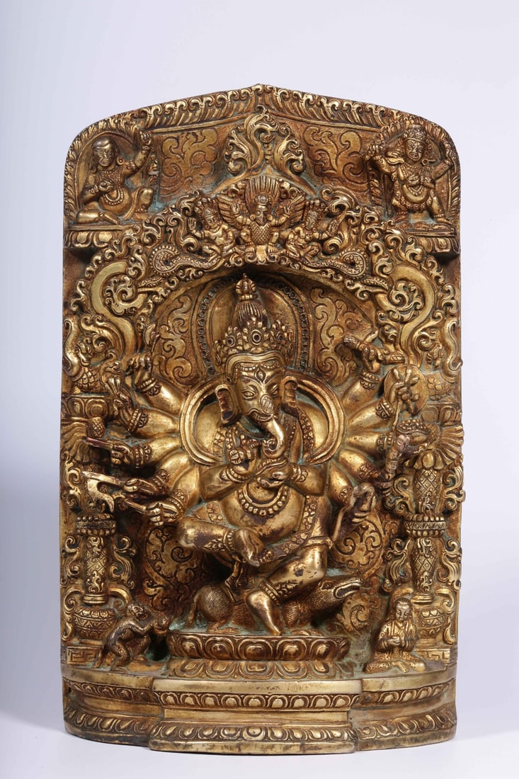 A Gilt Bronze Elephant-Trunk Deity Plaque: A Gilt Bronze Elephant-Trunk Deity Plaque. Height: 7.68in; Length: 4.53in; Width: 1.97in.