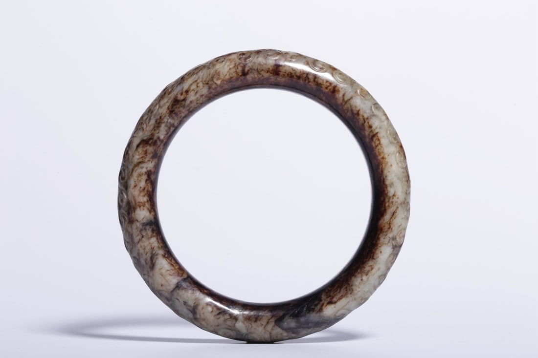 A Hetian Jade Bracelet: A Hetian Jade Bracelet. Diameter: 3.54in; Inner Diameter: 2.52in; Width: 0.59in.