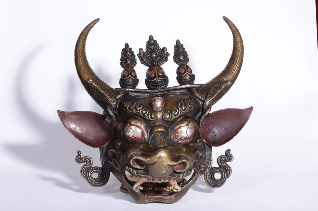A Bronze Silver-Inlaid Mask: A Bronze Silver-Inlaid Mask. Dimensions: 13.78in x 13.39in x 5.71in.