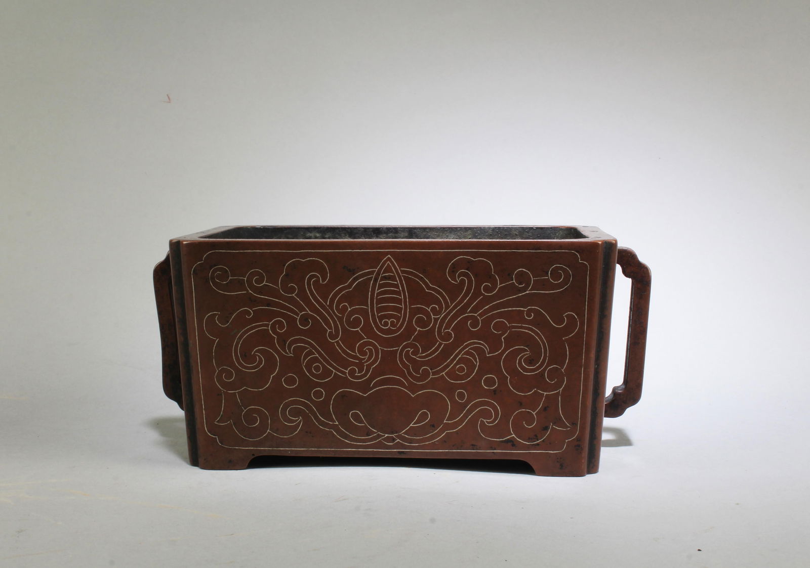 A Bronze Censer: A Bronze Censer, with silver inlay in relief. Seal Mark at base. Length: 7" Height: 3" Width: 3.75"