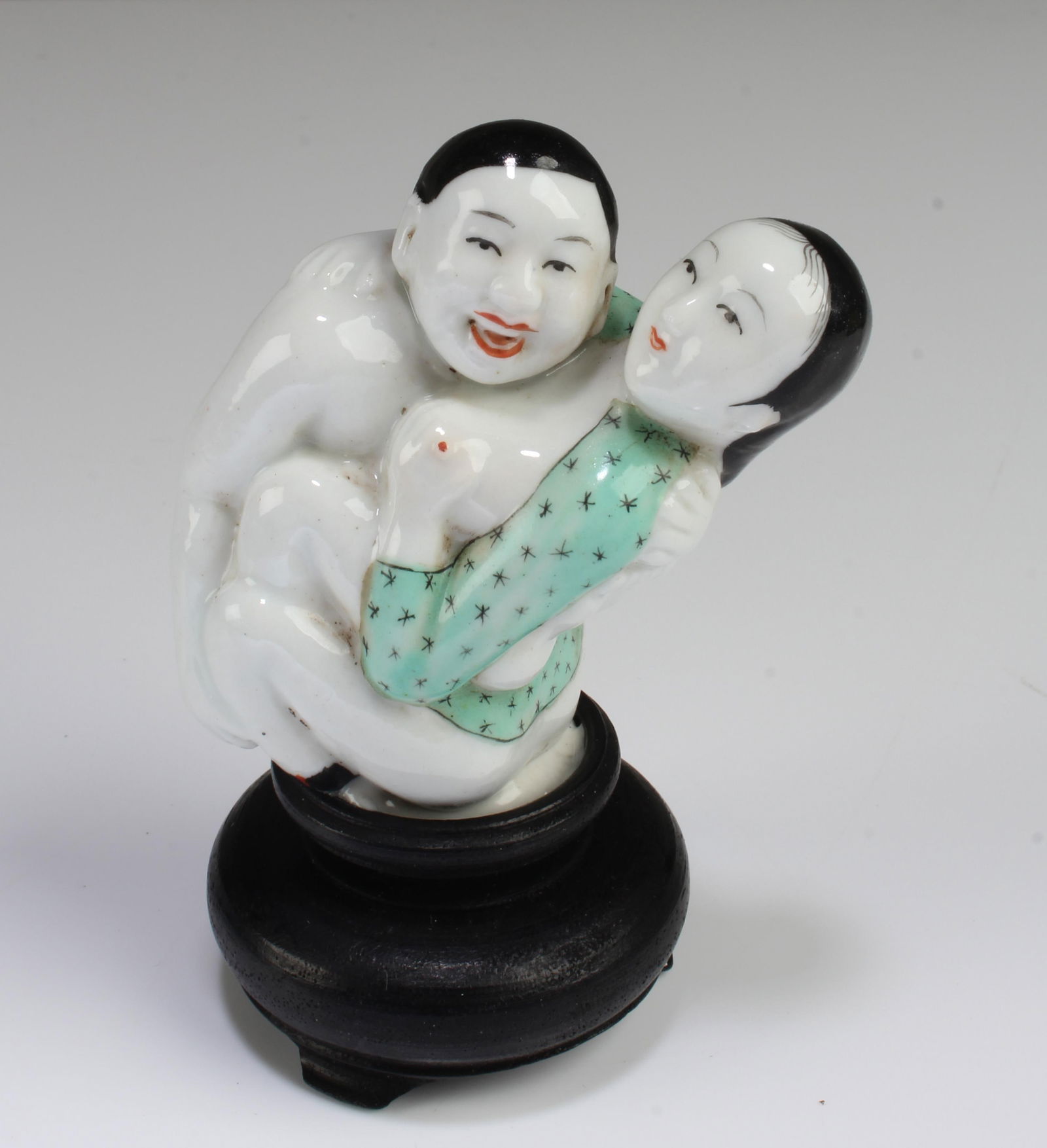 A Porcelain Erotic Display Ornament: A Porcelain Erotic Display Ornament. Comes fitted with a stand. Height: 2.5" (does not include stand)