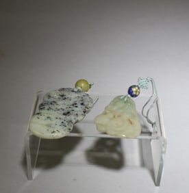 A Group of Two Jade Pendants