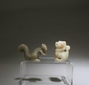 A Group of Two Jade Ornaments
