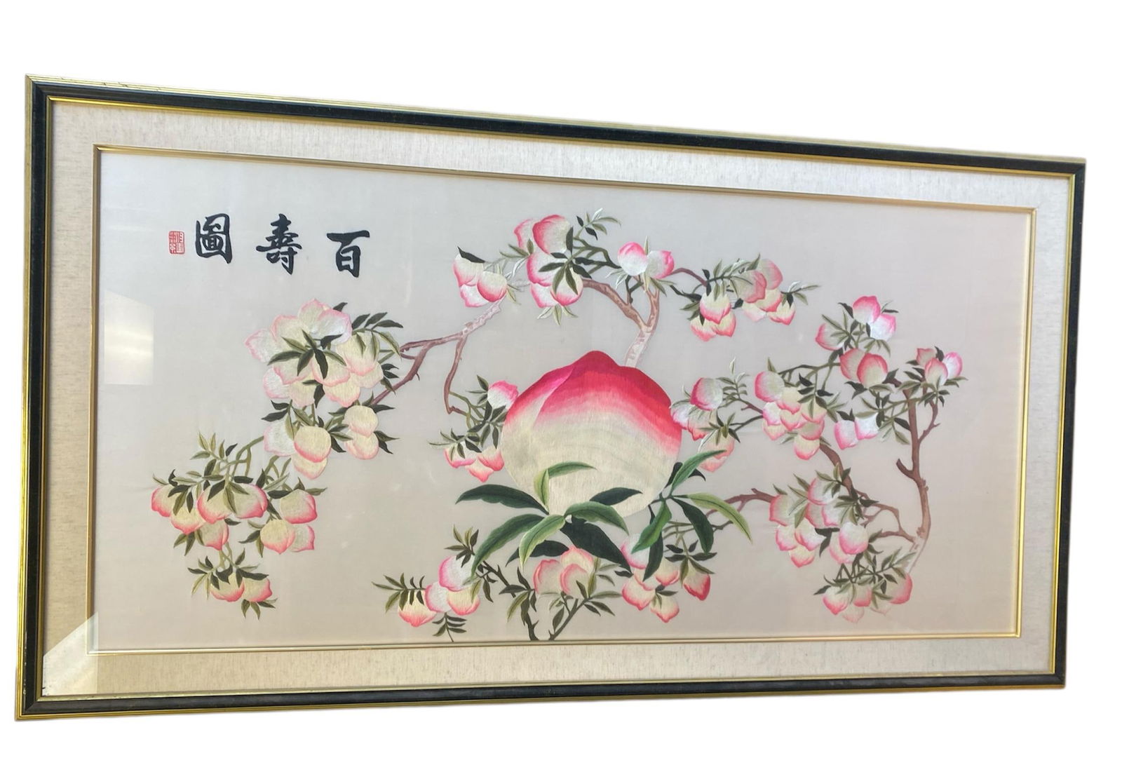 A Framed Embroidery Painting: A Framed Embroidery Painting Depicting Longevity Peaches. Dimensions: 34.5" x 62.5".