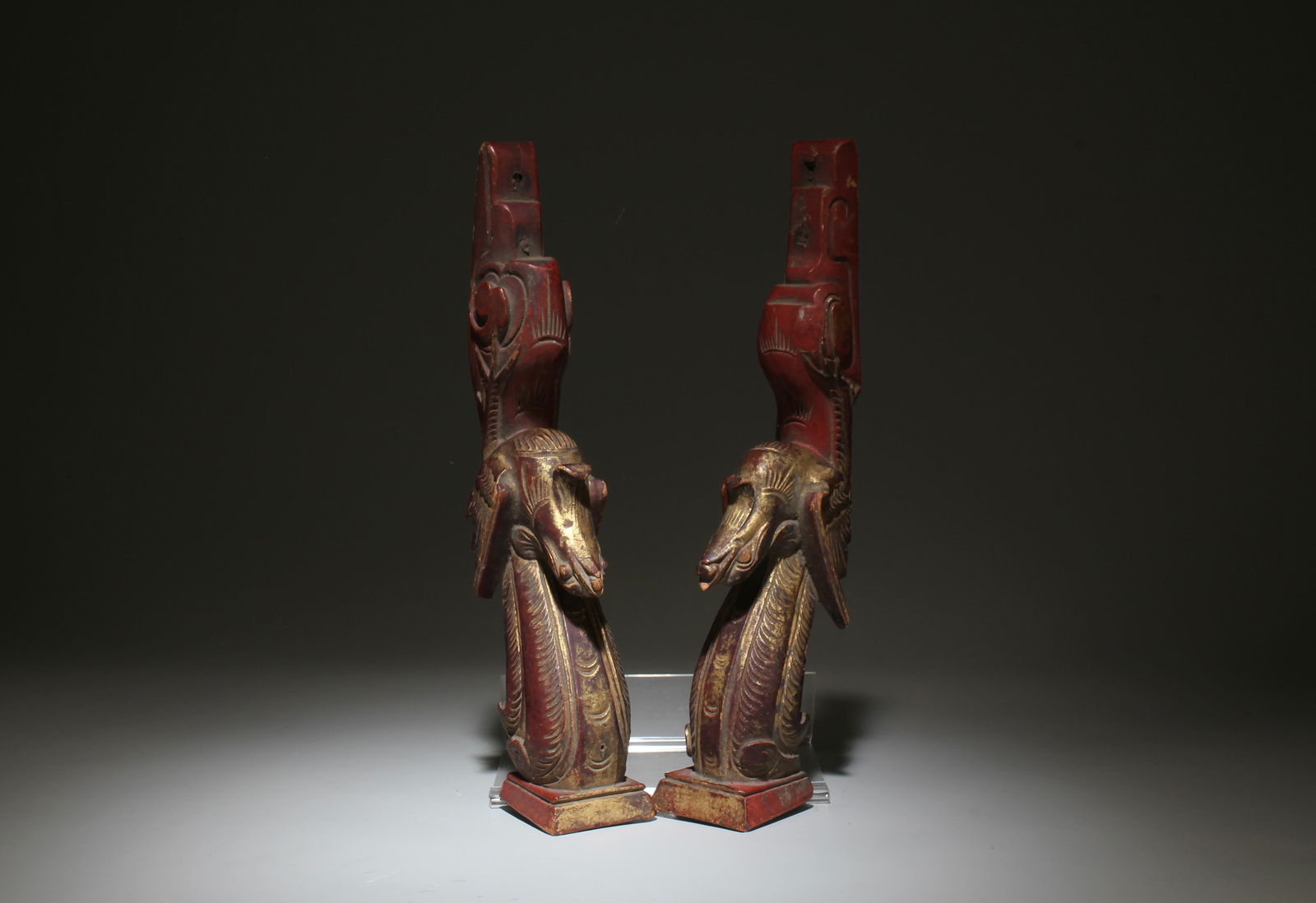A Pair of Wooden Ornaments: A Pair of Wooden Ornaments. Dimensions: 10" x 3" x 1.75".