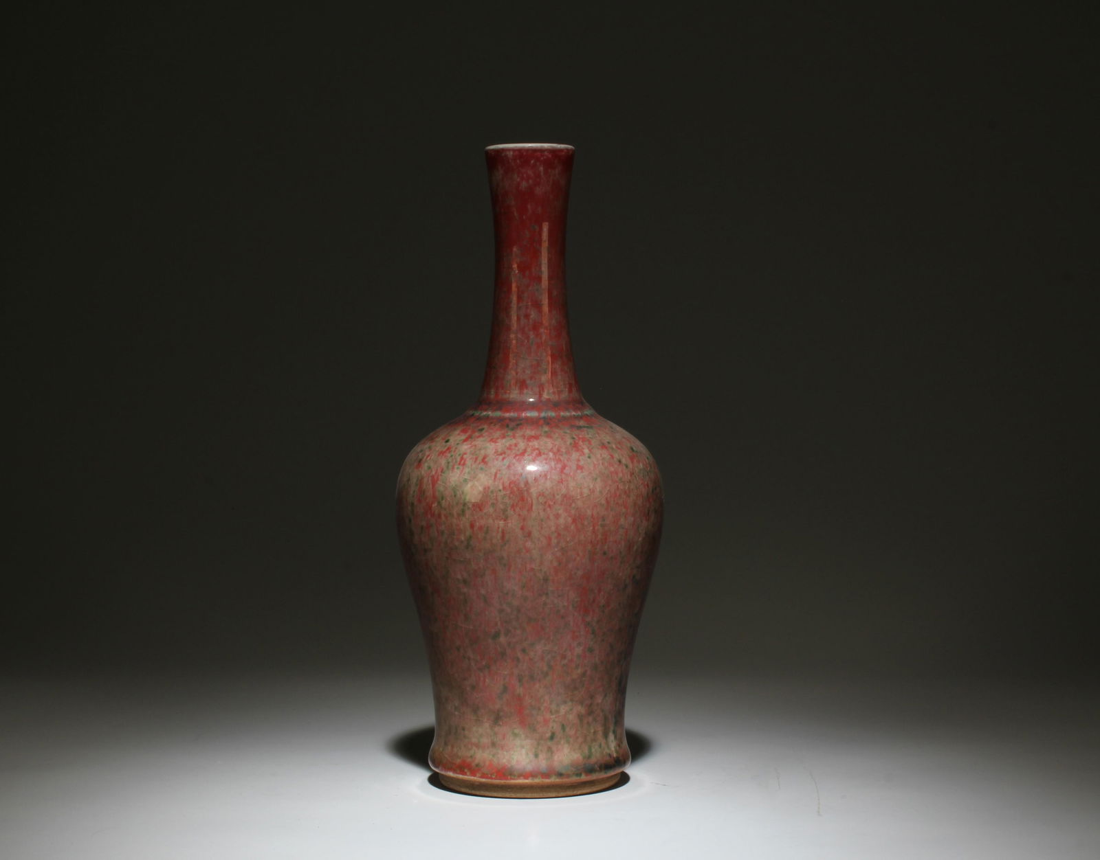 A Flambe Peachbloom-glazed Vase: A Flambe Peachbloom-glazed Vase. Dimensions: 4" x 9".