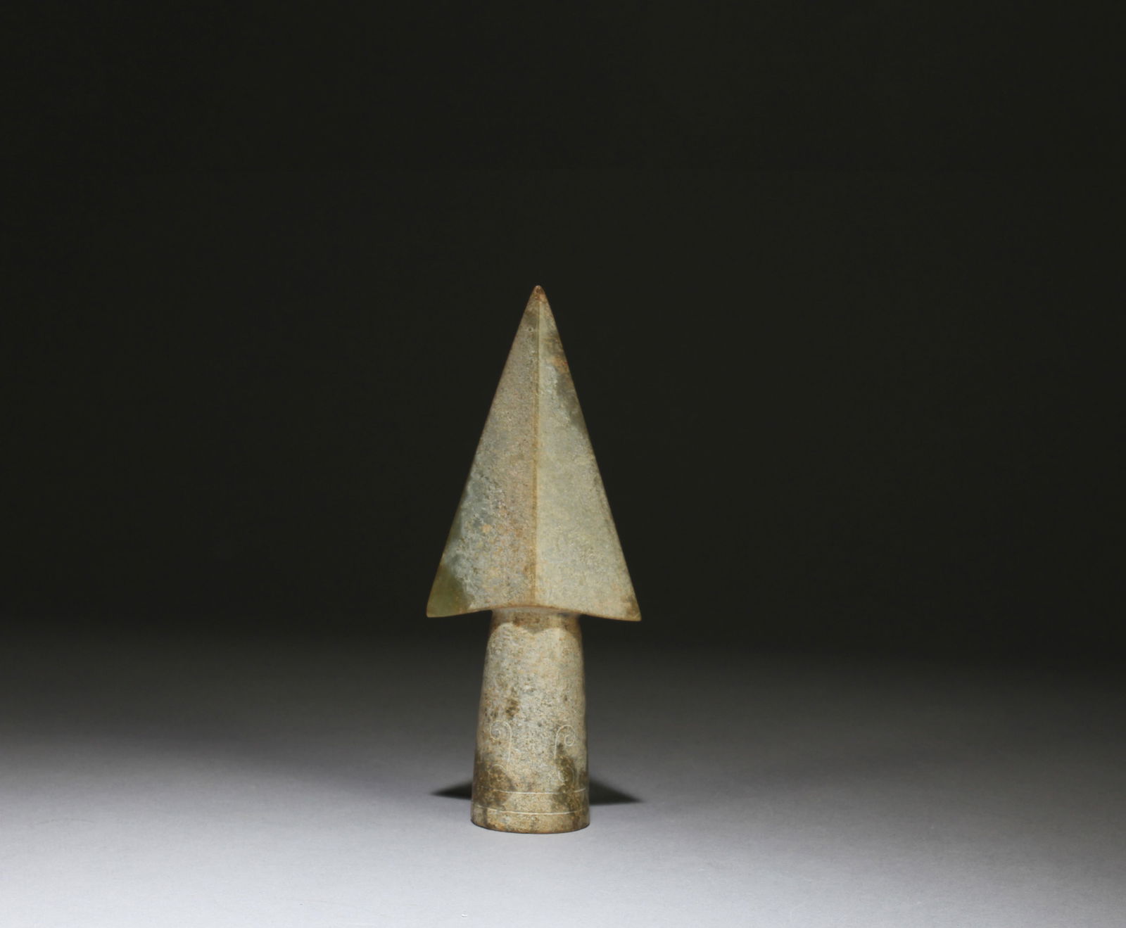 A Carved Jade ArrowHead: A Carved Jade ArrowHead. Height: 4.92in. Length: 2.09in.